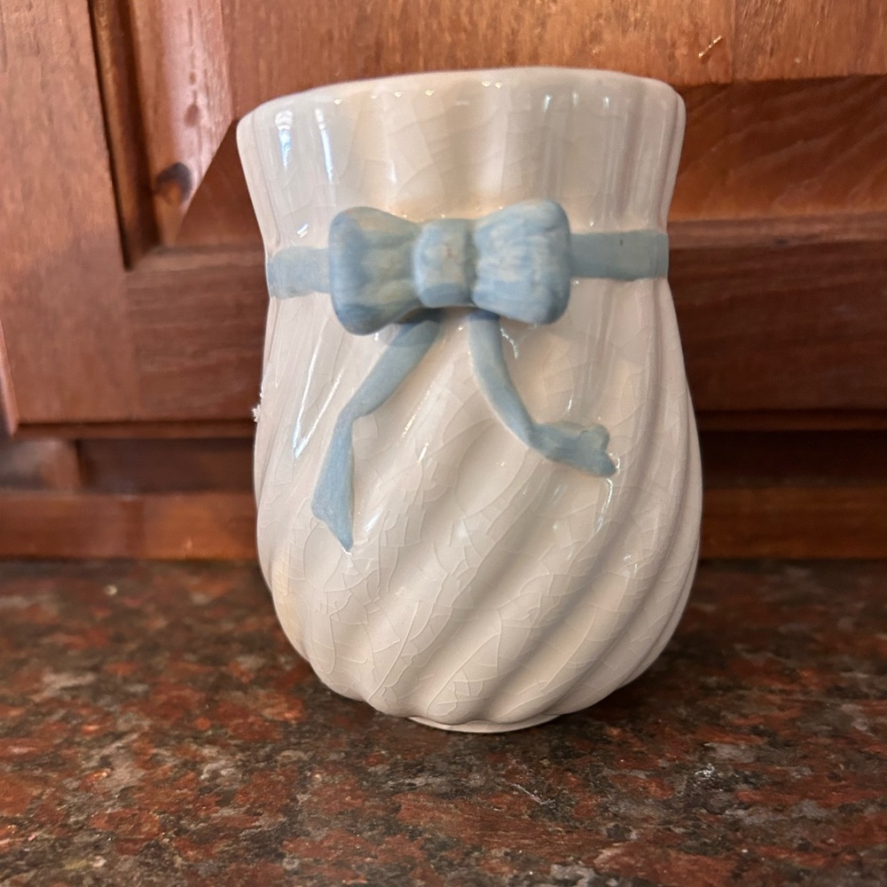 Little white dish with blue ribbon